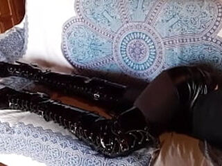 Total black with fishnets pantyhose and boots over the knee