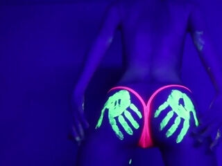 Dances And Hula Hoops Under A Black Light