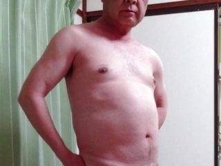 An elderly Japanese nudist shows a poor cock to the world