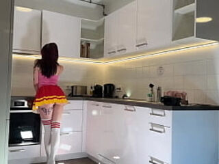 Hottest redhead tattooed cheerleader with over knee socks shows her see through panties in the kitchen
