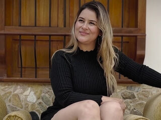 Thick latina sits back on the sofa enjoying him playing with her pussy