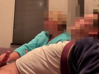 'Casual handjob from wife while watching tv on couch'