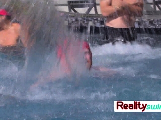 Swinger couples have fun outdoor games at the pool