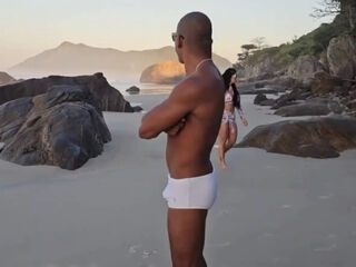 Hot brunette with nice big tits has a good pounding on the rocky seashore with her BBC friend