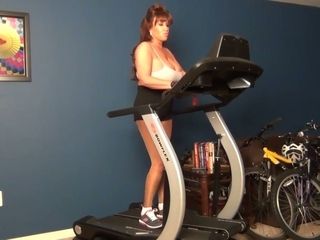 This sexy housewife knows her way around a treadmill and she's got big tits